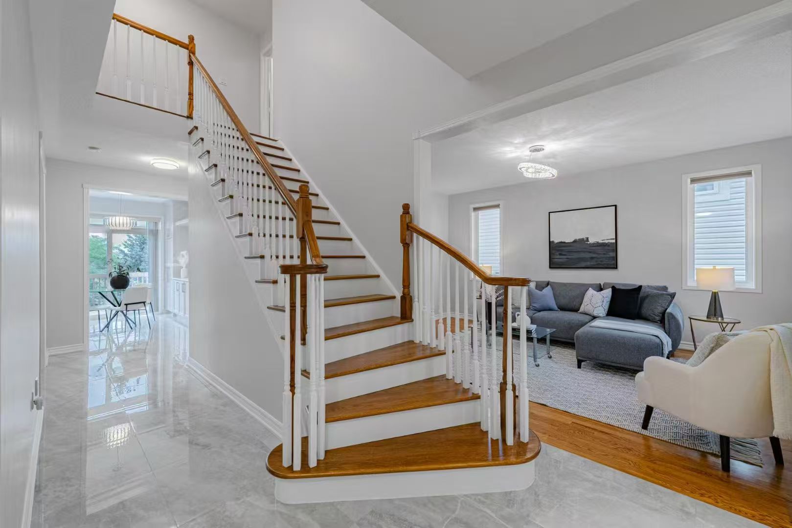 Entry and staircase after refinishing and staging